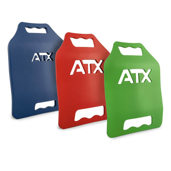 Three ATX® Tactical Weight Vests in blue, red, and green—each featuring a cut-out handle and ATX lettering—are standing upright in a row against a white background.
