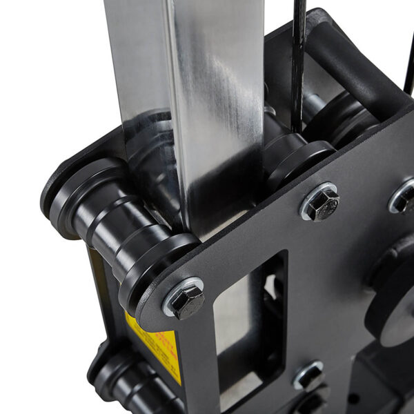 Close-up of the ATX® Cable Crossover 500 198cm, featuring a black and silver pulley system with multiple wheels, metal components, bolts, and a tension cable. The image highlights intricate structural details.