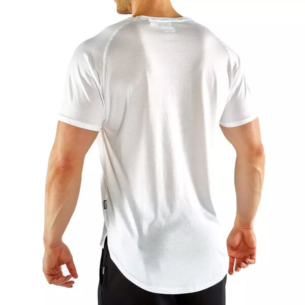 A person is shown from the back, standing against a white background, wearing an ATX® - T-Shirt White with a plain design, short sleeves, and rounded hem paired with black pants.