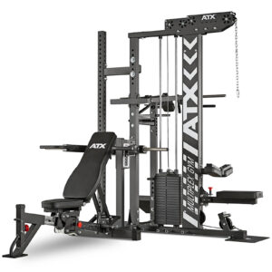 The ATX® MultipleX Multi Gym - 700 is a multifunctional home gym machine, predominantly black, featuring a weight bench, cable system, and various attachments for strength and conditioning exercises.