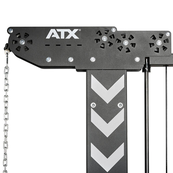 Close-up of a black ATX® MultipleX Multi Gym - 700 component, showcasing a left-chain and right-dual cables. The surface has small holes and features white chevron stripes on the central vertical bar.