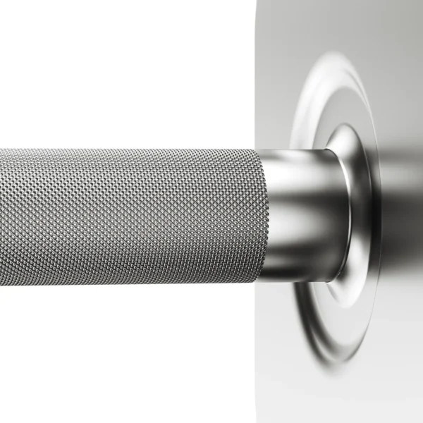 Close-up of a textured silver Ironmaster 75 LB Quick-Lock Adjustable Dumbbell without stand, highlighting a knurled grip near a smooth, rounded plate against a blurred gray background.