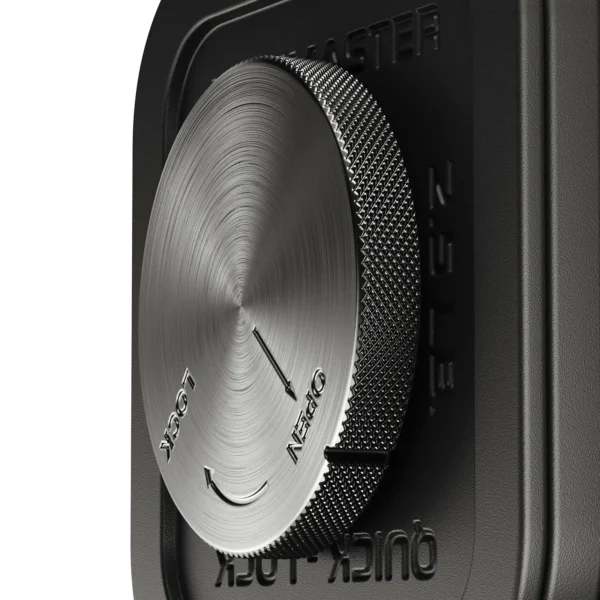 Close-up of a stainless steel combination lock dial on a black safe, matching the precision of the Ironmaster 75 LB Quick-Lock Adjustable Dumbbell Set. The dial has directional arrows, Open and Lock engravings, and a textured edge for a firm grip.