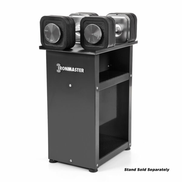 The Ironmaster 75 LB Quick-Lock Adjustable Dumbbell Set prominently rests on a sleek black stand, featuring two shelves and showcasing the brands name, with Stand Sold Separately noted in the bottom right corner.