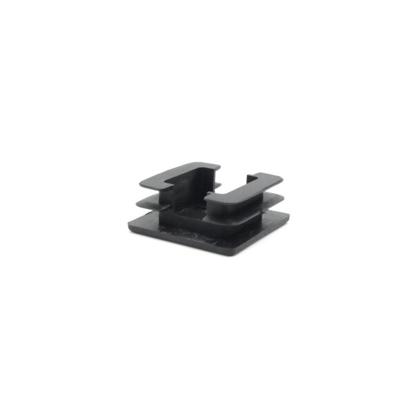 A small black plastic clip with a square base and open, U-shaped top, ideal for securing cables and wires. It is isolated on a white background. Product Name: 30mm x 30mm End Cap.