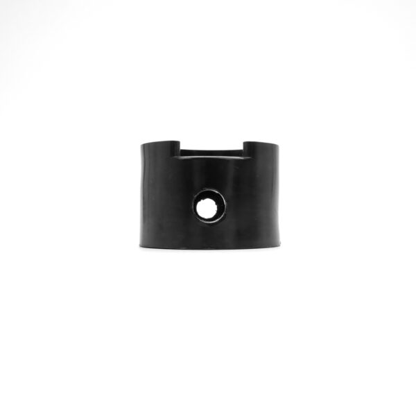A Treadmill Deck Spring, black and cylindrical with a smooth surface and central hole, stands upright against a plain white background.