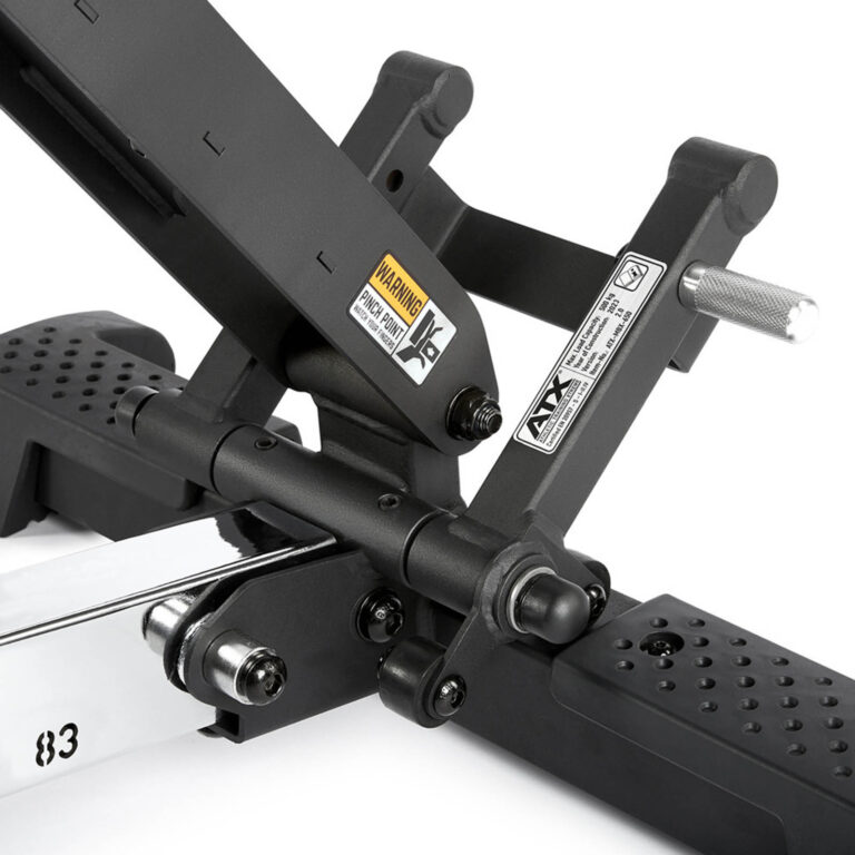 Close-up of a black adjustable bench support mechanism, highlighting its fid bench versatility. The image showcases various metal components, warning labels, and a handle grip. The perforated platform ensures traction, while the sleek bench frame provides sturdy support for any workout routine.