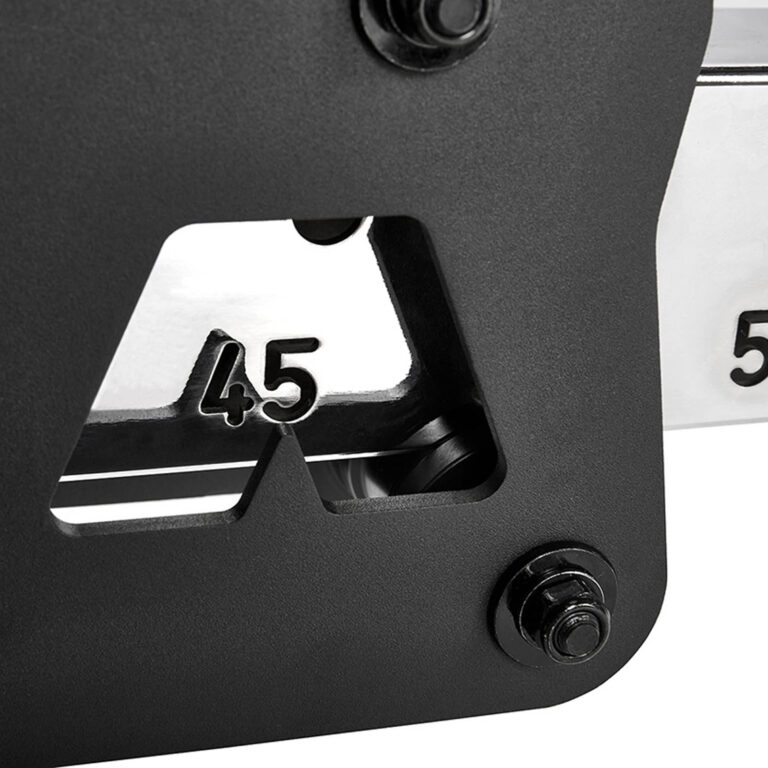 Close-up of a black and silver tool or device featuring numbers 45 and 50, possibly integral to a fid bench adjustment mechanism. The numbers are cut out in the metal, and bolts are visible on the black surface, suggesting precise measurement capabilities.