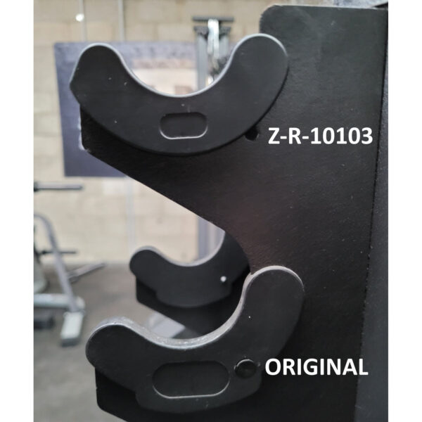 Close-up of a Dumbbell Handle Seat in a gym, featuring two U-shaped hooks. The text Z-R-10103 is near the top hook and ORIGINAL near the bottom hook. Out-of-focus gym equipment is visible in the background.