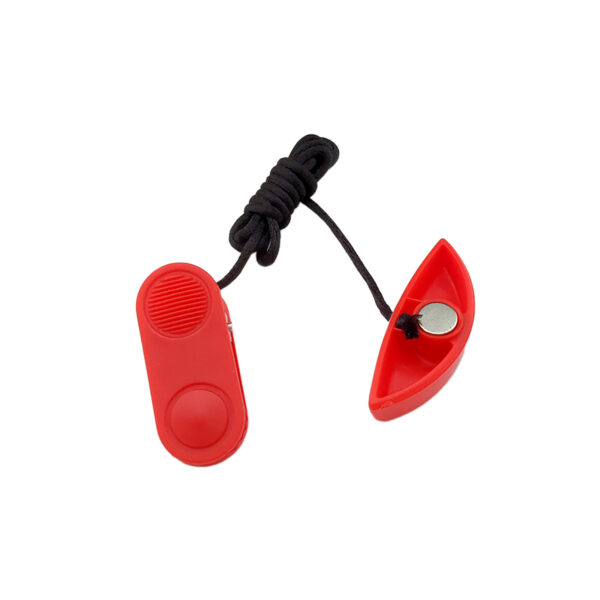 A red dog training clicker with a cord, featuring a button for sound and a detachable half with a magnet.