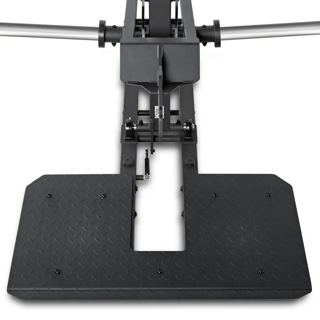 Close-up of the ATX® Belt Squat Compact featuring a black, diamond-patterned metal platform with attached rods, highlighting its central mechanism and heavy-duty construction typical of gym equipment.