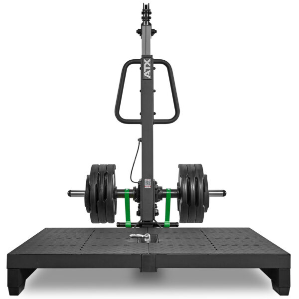 A strength training machine equipped with multiple weight plates on each side, set on a solid, non-slip platform. It features a central handlebar and adjustable settings for resistance training exercises.