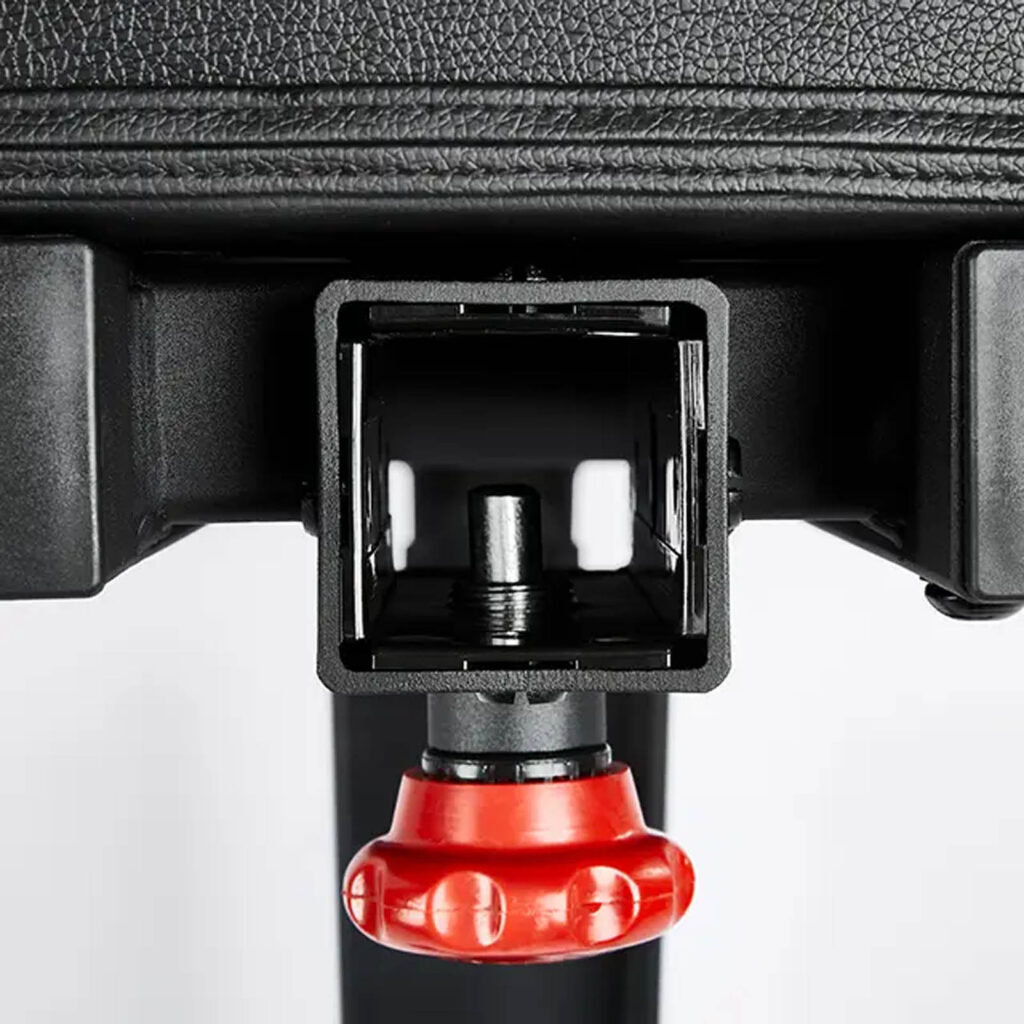 Close-up of the ATX® Commercial FID Bench ATX-MBX-660, featuring a black rectangular mechanism with a red knob at the bottom, highlighting its textured surfaces and visible components.