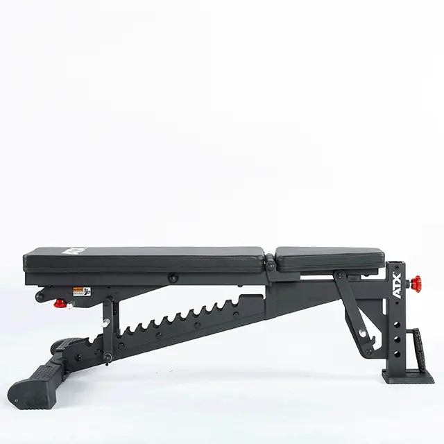 The ATX® Commercial FID Bench ATX-MBX-660, in black with a padded seat and backrest, offers multiple incline settings for flat incline bench workouts. Its sturdy frame features the ATX logo on the side, set against a plain white background.