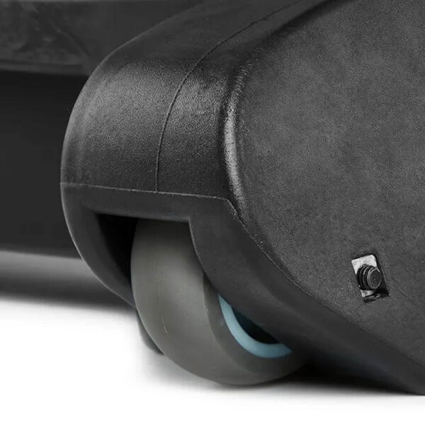 Close-up of a suitcase wheel featuring a sleek, grey caster, echoing the robust design of the ATX® Commercial FID Bench ATX-MBX-660. The wheel is mounted at the corner, displaying its hard plastic casing and a small screw.