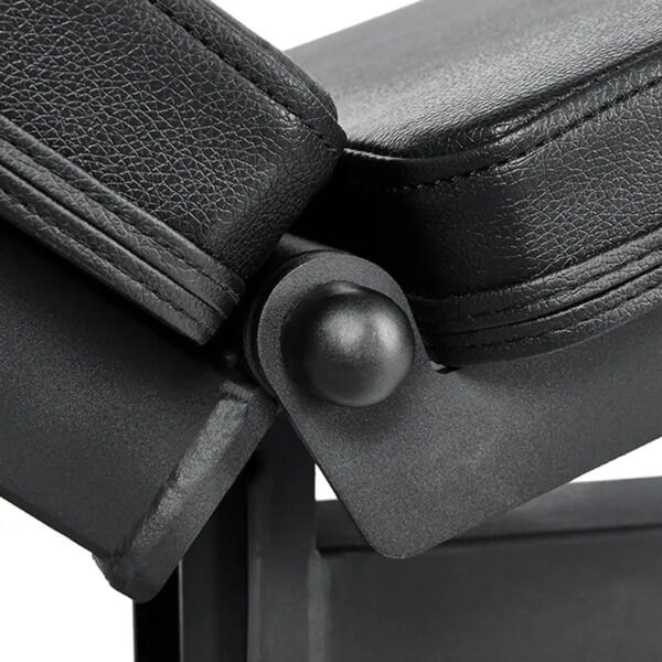 Close-up of the ATX® Commercial FID Bench ATX-MBX-660, a black adjustable flat incline bench with two padded sections connected by a hinge joint. It features a textured, leather-like surface.