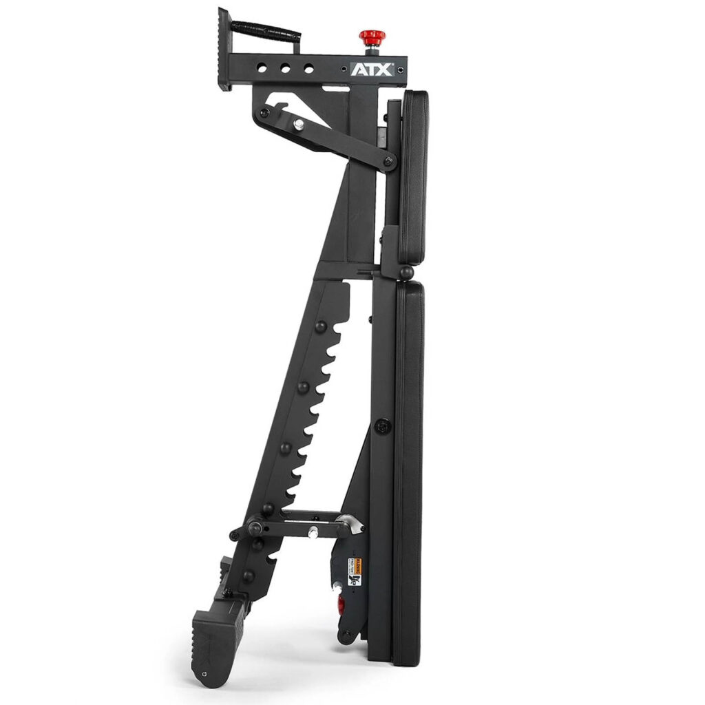 Side view of the folded ATX® Commercial FID Bench ATX-MBX-660, highlighting its compact design as a flat incline bench in black with multiple adjustment levers and wheels for easy mobility.