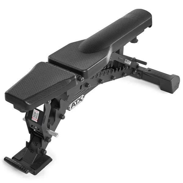 The ATX® Warrior Bench - Slim PU is a black adjustable weight bench featuring a cushioned surface, multi-position backrest and seat with marked adjustment mechanisms, and a robust metal frame with supportive legs for stability during workouts.