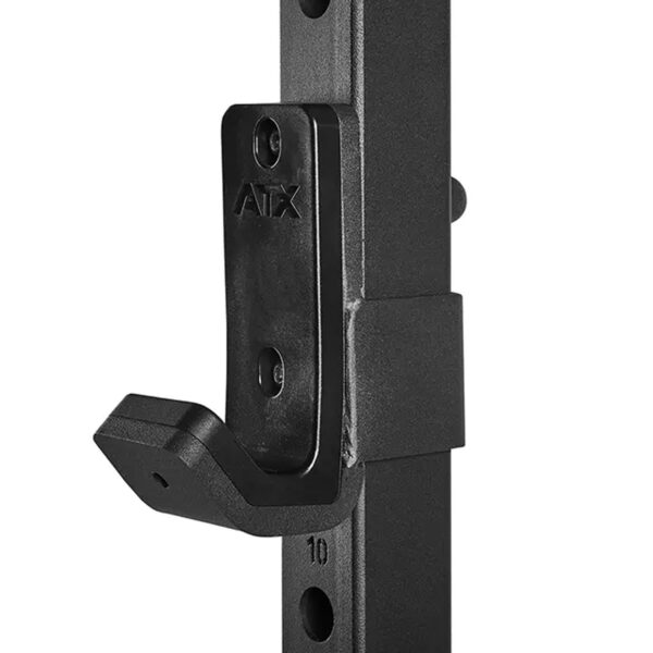 Close-up of a black metal adjustable J-cup holder attached to a vertical rack, featuring an engraved ATX® Smith Machine 500 - Low Ceilings - 198 cm brand name.