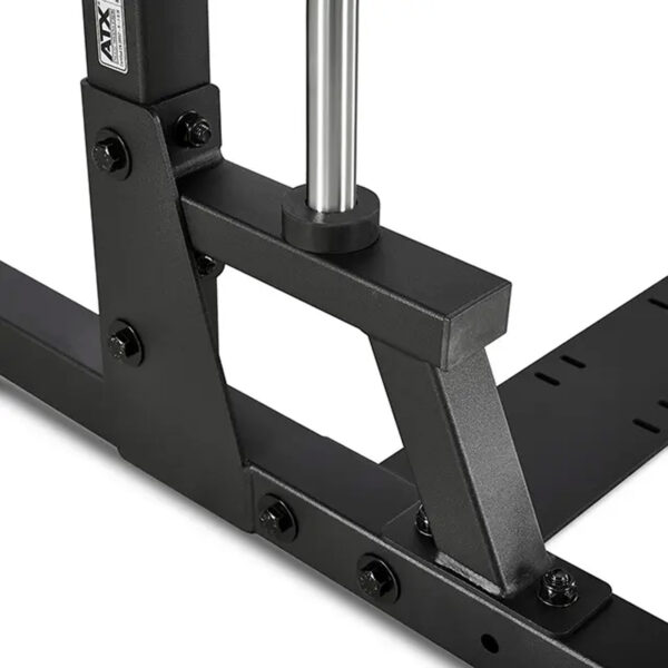 Close-up view of a black, angular metal structure with bolts from the ATX® Smith Machine 500 - Low Ceilings - 198 cm, featuring a vertical shiny metal bar positioned at the corner.