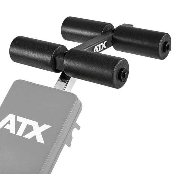 Close-up of a gym bench with black foam roller pads, featuring the ATX® AB Attachment logo. Designed for leg support or extensions, it showcases a sturdy metal frame and cushioning for comfort, highlighting the benchs detail.