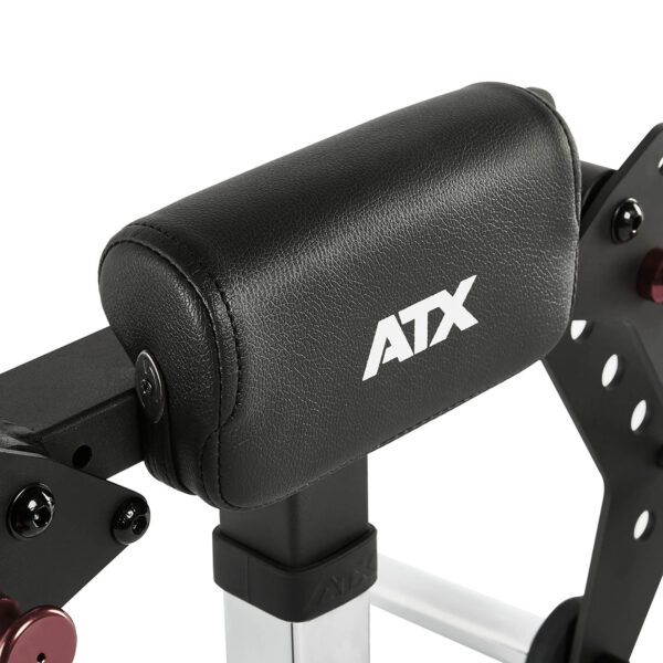 Close-up of a black headrest on the ATX® Pec-Fly Attachment, featuring a padded surface and metal support structure.