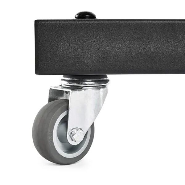 A metal caster wheel is attached to the bottom of the ATX® Attachment Storage Racks black rectangular frame. The gray wheel features a smooth surface and is connected by a metal bracket for rotation and mobility.
