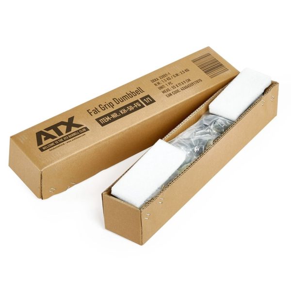 A brown cardboard box with ATX® Fat Grip Dumbbell on it is open, showing a dumbbell nestled in white foam packaging.