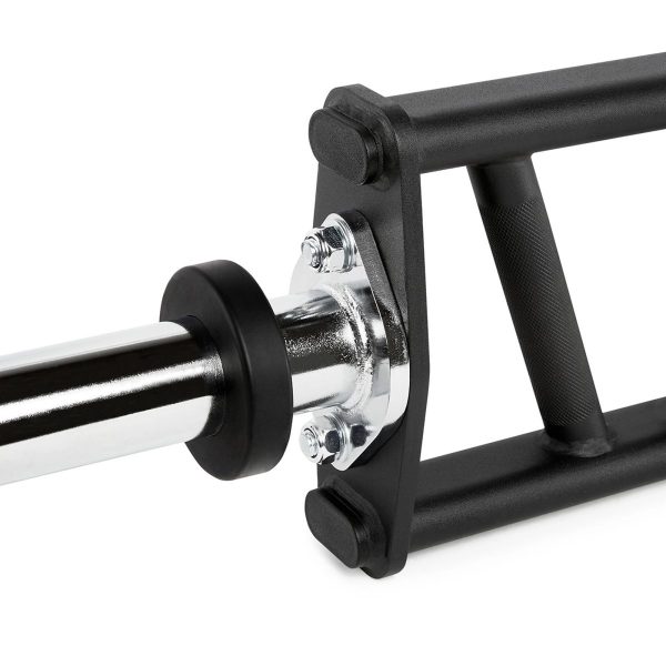 Close-up of a black trap barbell, showing the knurled handle for grip and the shiny metal bar attached. The frame is angular and designed for weightlifting exercises.
