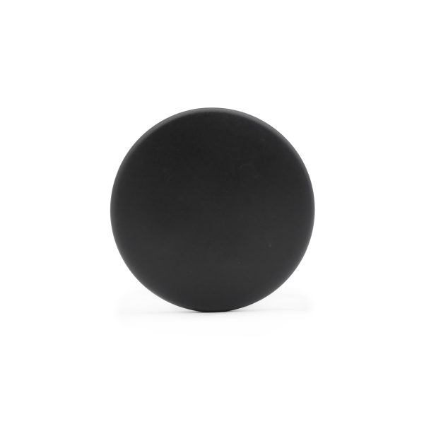 A Foam Roller Cover 65mm in black, featuring a round and flat design with a smooth surface, set against a white background.