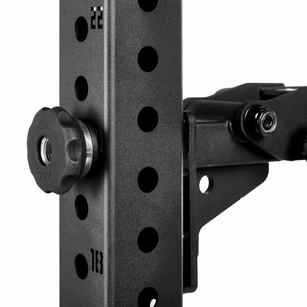 Close-up of a black metal adjustable bracket with a knob and multiple holes for height adjustment. The surface has a textured finish, and there are visible bolts securing the components.