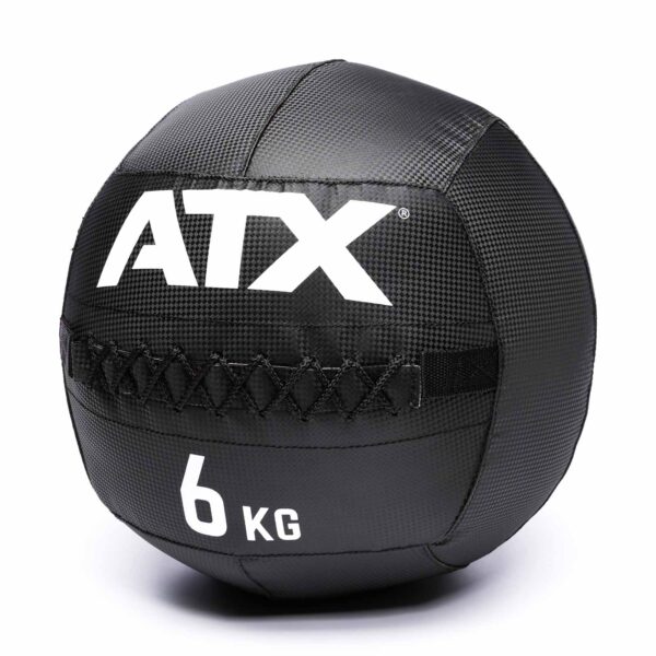 The ATX® Wall Balls PVC is a black, textured medicine ball featuring ATX and 6 KG in white, with stitched detailing across the middle.