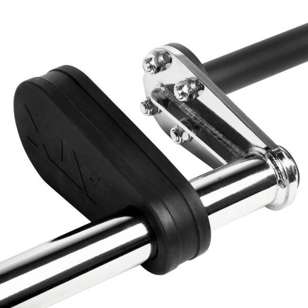Close-up of a safety squat bar resting on a metal rack with black padding. The barbell features shiny silver with black end caps, and the rack shows bolts and a sturdy design. The brand name is visible on the padding.