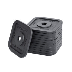 A stack of square, black Ironmaster adjustable dumbbell plates with rounded corners stands neatly. Each plate is marked with text and a weight of 2.2 kg, while one leans slightly tilted against the rest, hinting at a versatile workout setup.