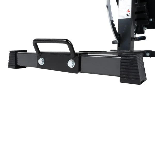 Close-up of the Ironmaster Bench Handle, a black metal bar with a handle supported by textured rubber end caps. Its bolted to a larger structure in the background.