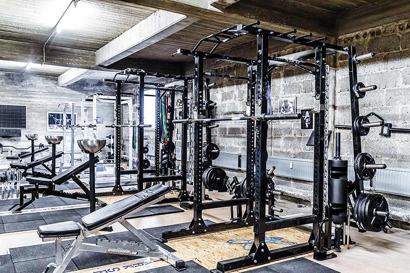 Barbarian commercial power rack in a strongman gym