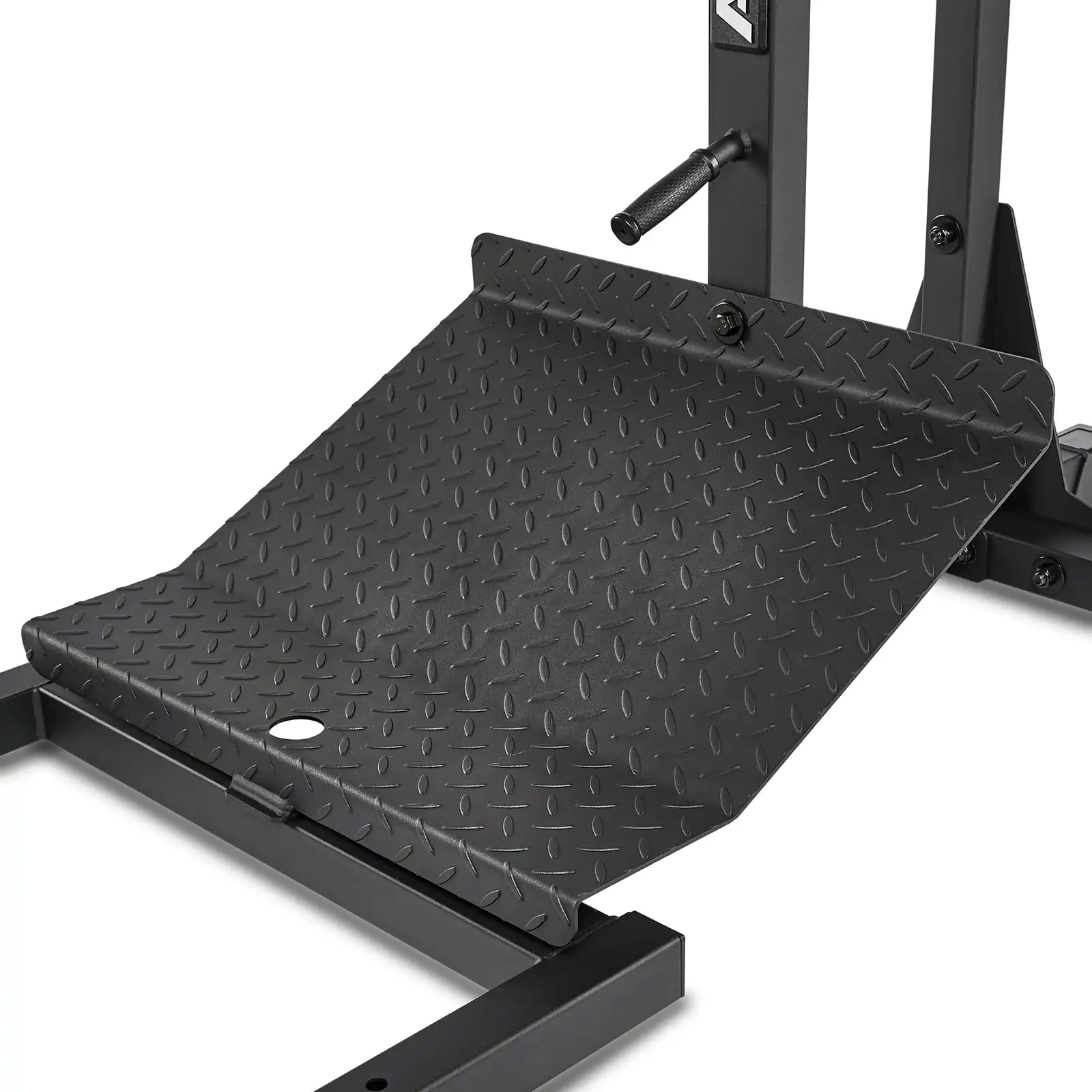 Close-up of a leverage squat machine footplate with a textured, diamond-patterned surface, mounted on a sturdy metal frame. The footplate ensures secure footing during intense exercises.