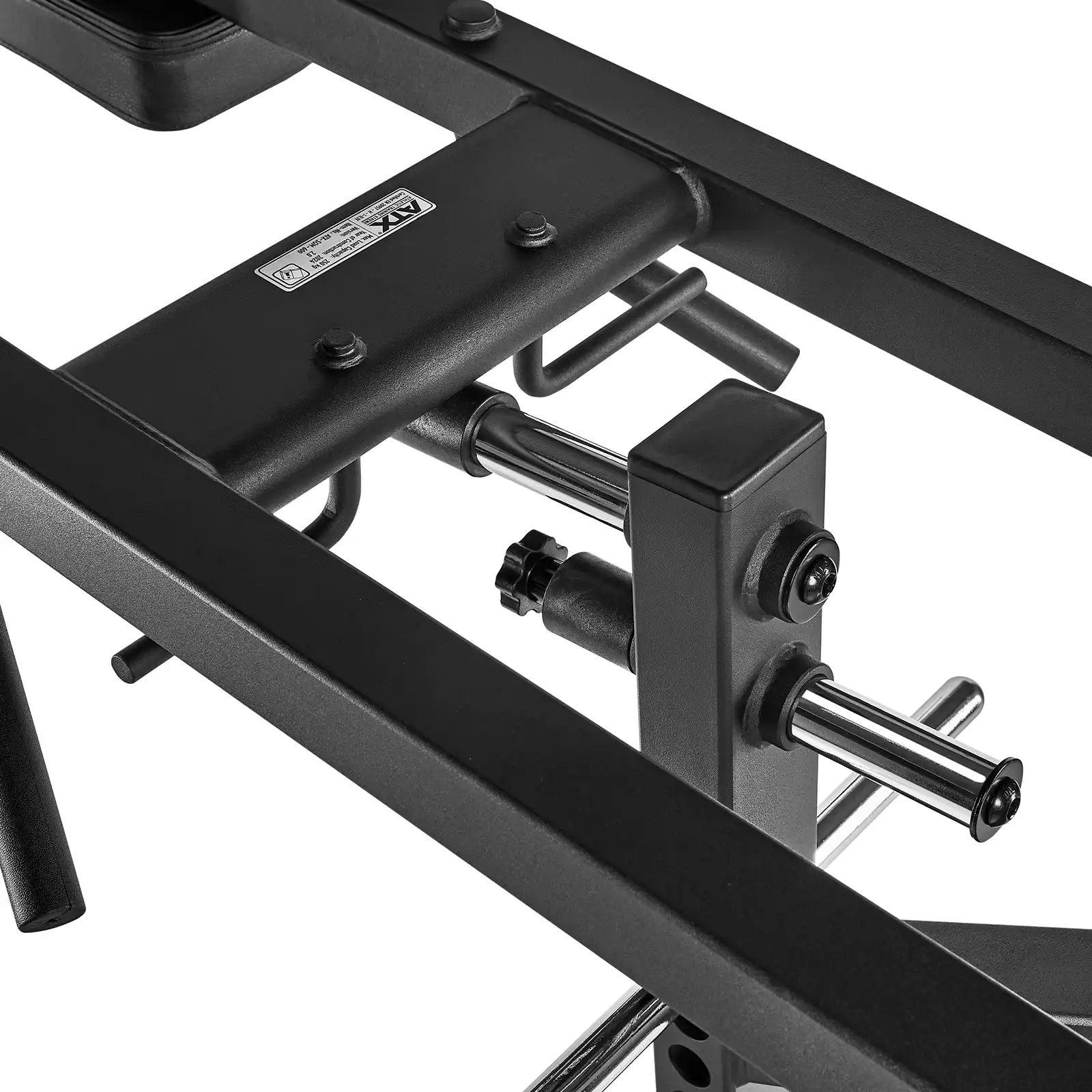 Close-up of gym equipment, focusing on black metal parts and adjustable components. The leverage squat machine design includes rods and bolts, showcasing its durable construction.