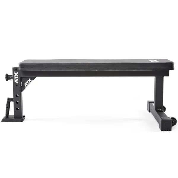 The ATX® Flat Workout Bench Attachment is a sturdy black bench with a cushioned surface, metal supports, and adjustable padding. It features ATX branding and appears stable, making it ideal for various strength training exercises.