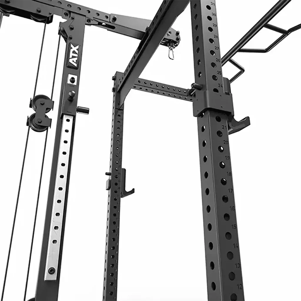 A sturdy and versatile ATX® Lat Option 780 Plate Loaded metal gym rack features various attachments like a pulley system and plate loaded lat pulldown attachment, along with multiple holes for adjustable settings to accommodate different weightlifting exercises.