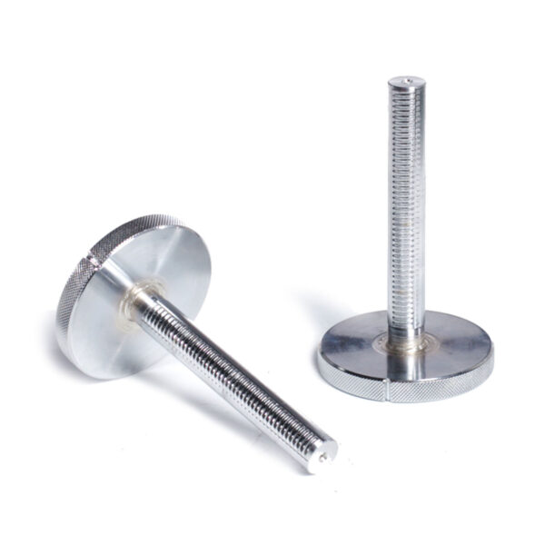 Close-up of two silver metal knobs with long threaded stems on a white background, reminiscent of Ironmaster Quick-Lock Add On Kit. One knob stands upright, the other lies on its side, highlighting the ridged texture and flat circular base.