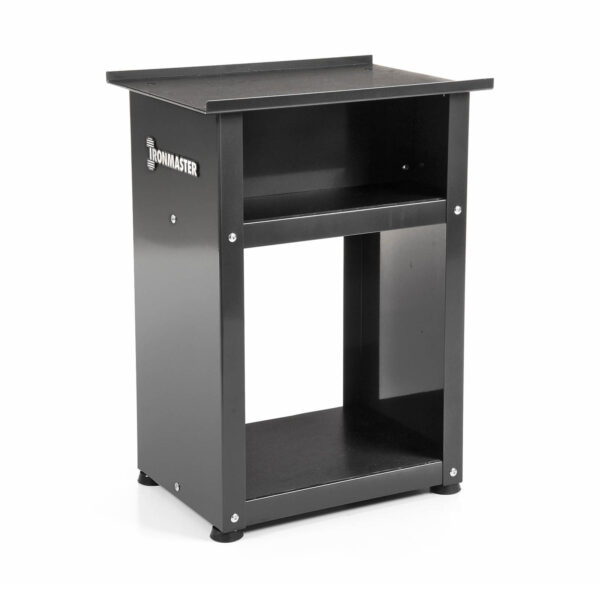 The sturdy black Ironmaster stand, with a flat top surface, open shelf, and base storage, is ideal for organizing gym equipment like Ironmaster Quick-Lock Adjustable Dumbbells. It adds style to your space with its sleek logo on the side.