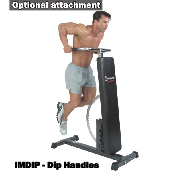 A person in gray shorts and white sneakers demonstrates an exercise using the IMDIP - Dip Handles on a fitness machine. Nearby, Optional attachment is visible, highlighting the Ironmaster Super Weights Benchs versatility.