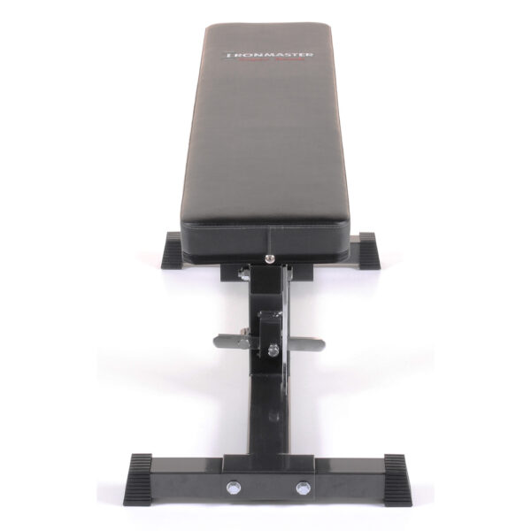 The Ironmaster Super Weights Bench is a flat, adjustable weight bench with a black padded surface and metal frame. Featuring sturdy legs with rubber feet for stability, it’s perfect for strength training exercises.