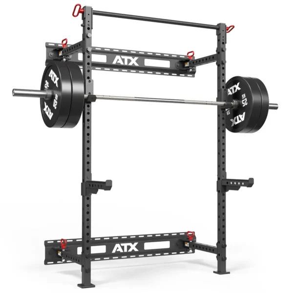 The ATX® Folding Squat Rack 500 is a sturdy black power rack that holds a loaded barbell, with adjustable safety bars and multiple height settings for various exercises.
