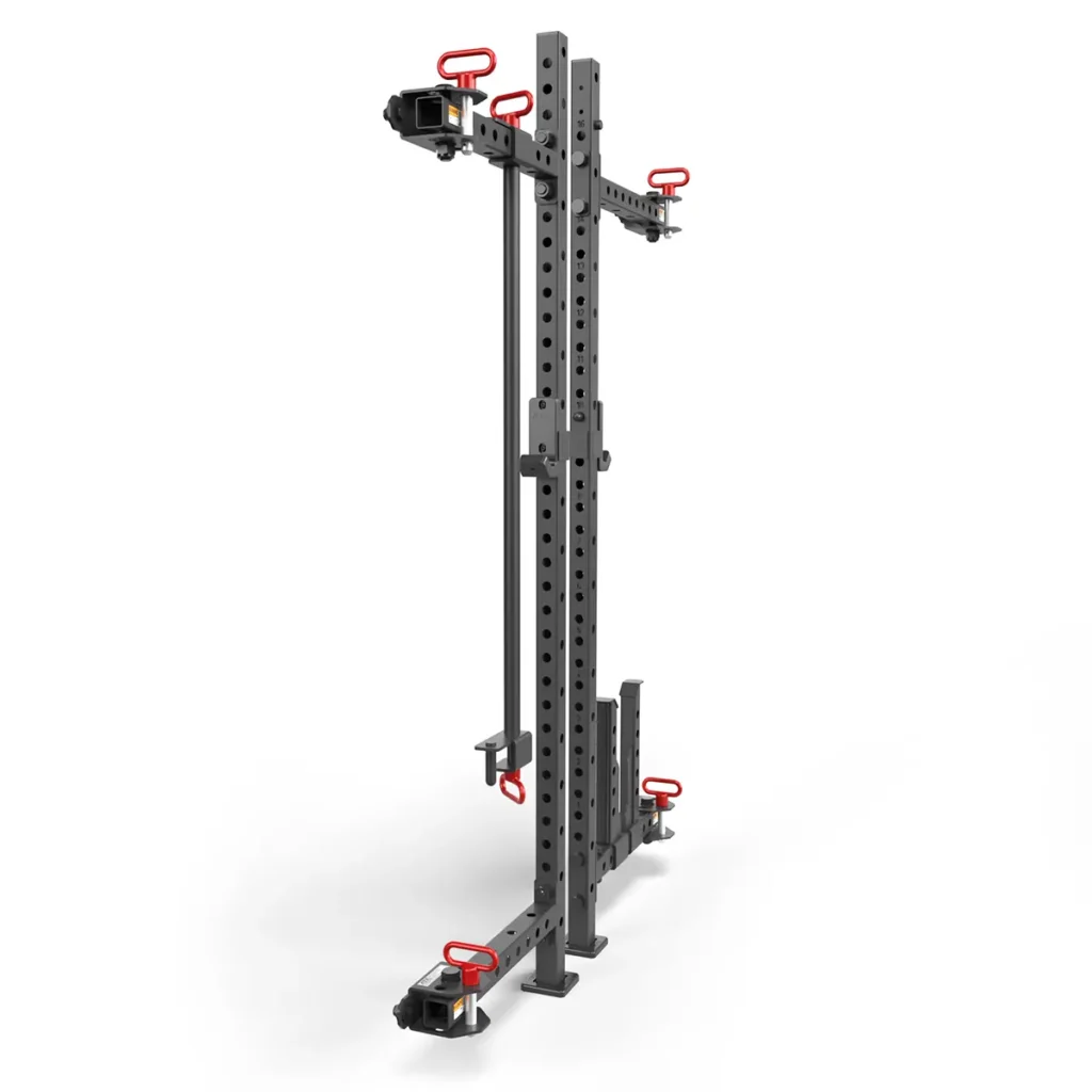 The ATX® Folding Squat Rack 500 is a black adjustable gym rig with red handles and attachment holes, ideal for weightlifting and strength training exercises. It is versatile and displayed against a plain white background.