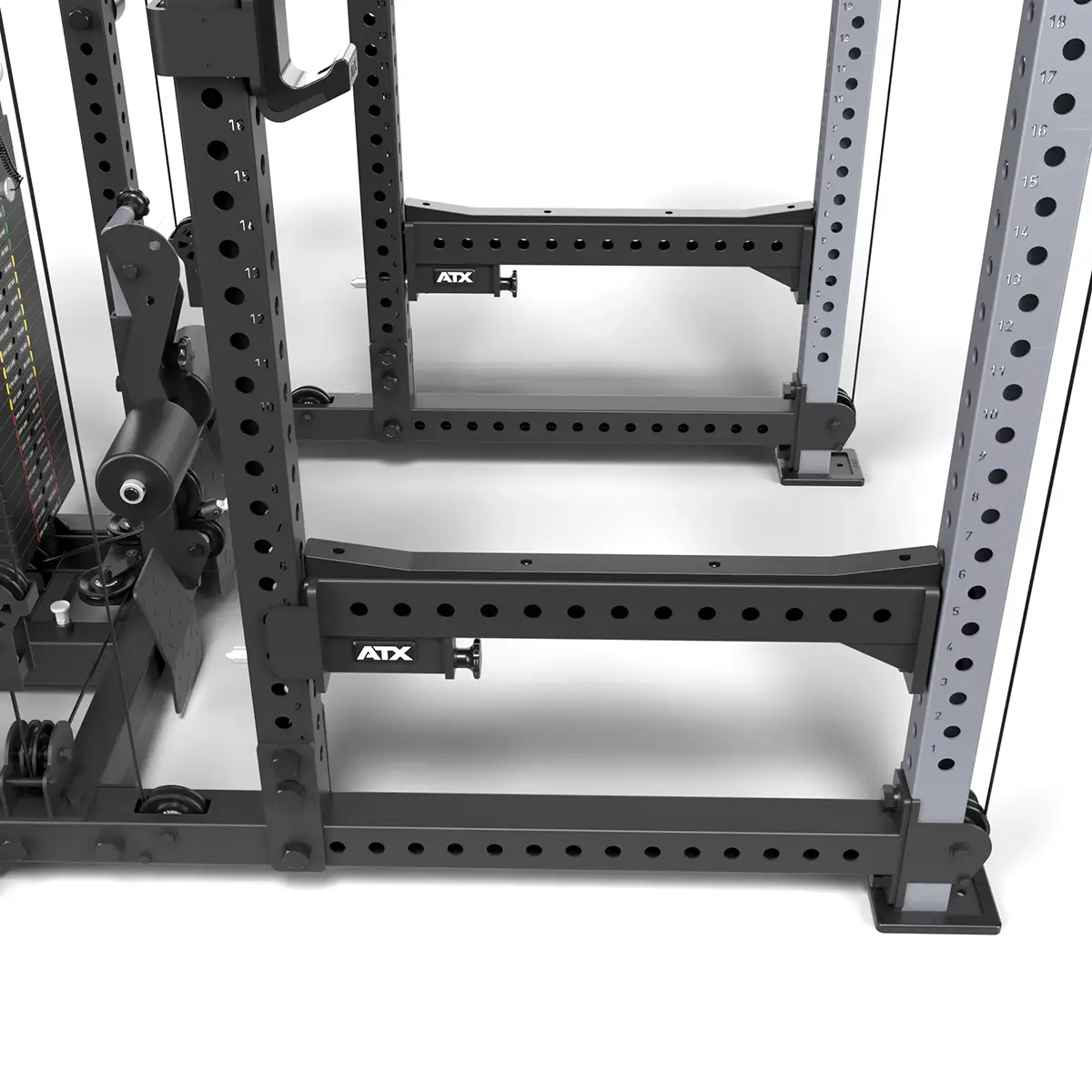 Close-up of an ATX® Power Cage with Cables, black and gray, featuring adjustable holes and ATX branding. Designed for strength training, this sturdy metal rack is set against a white background.