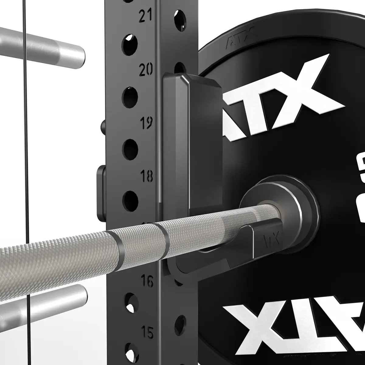 Close-up of an ATX® Power Cage with Cables, showing a barbell on the power rack. The barbell, with metal grips, rests on a black bracket and features ATX branding on the weight plates and numbered height adjustments for precision exercises.