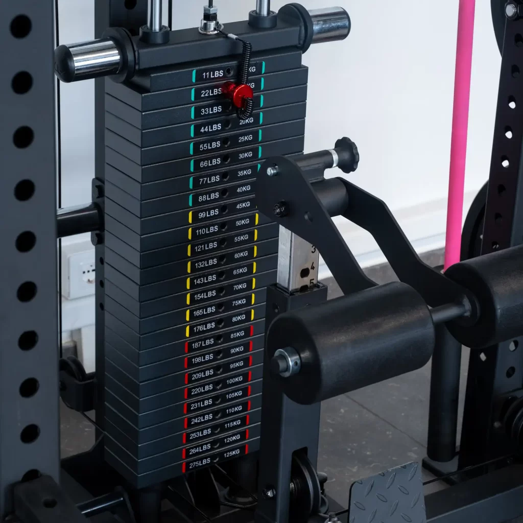 The ATX® Power Cage with Cables has a weight stack featuring plates labeled in pounds and kilograms, ranging from 11 lbs (5 kg) to 170 lbs (77 kg). The pin is currently set at the 27 lbs (12 kg) plate.