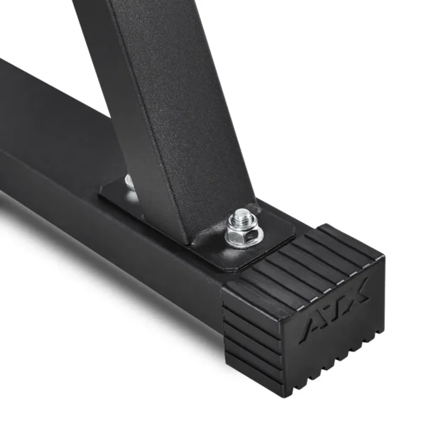 Close-up of a black ATX® metal bracket with ribbed rubber foot, likely part of the Cable Lat Pull Down Machine. The bracket has two bolts attaching it to a rectangular base, indicating its function in supporting exercise equipment.